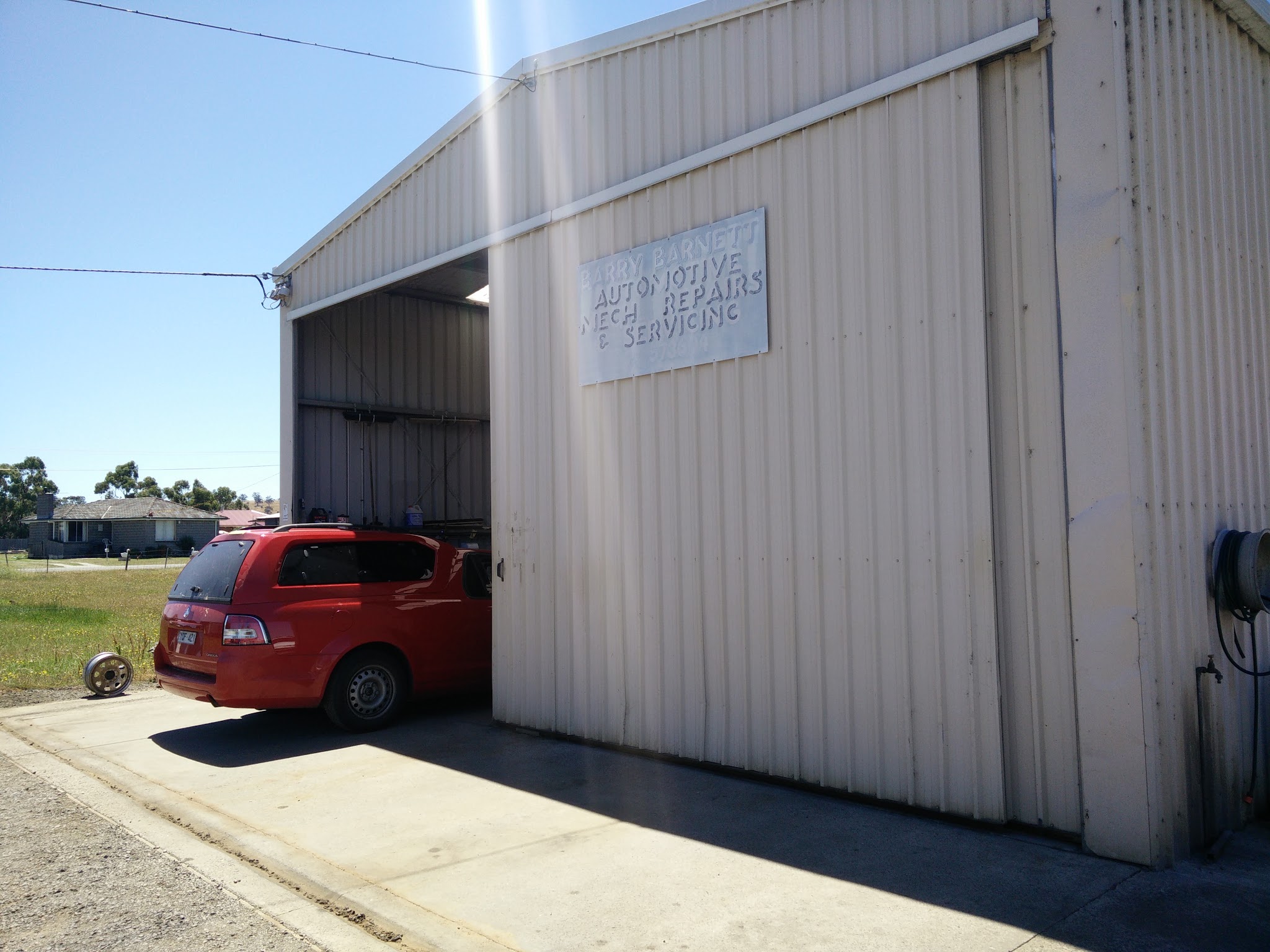 The Barnett Auto Solutions workshop on Melbourne Street, Triabunna, with the roller door open